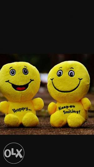 Two Yellow Smiley Plush Toys