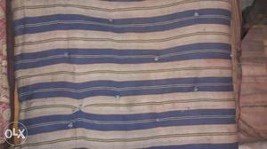 White And Blue Striped Mattress