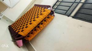Yellow And Brown Folding Bed