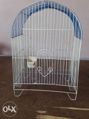 Birds cage in good condition.blue & white colour.