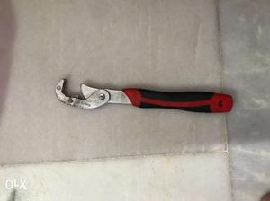 Black And Red Handled Hand Tool