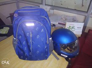 Blue Backpack And Blue Full Face Motorcycle Helmet