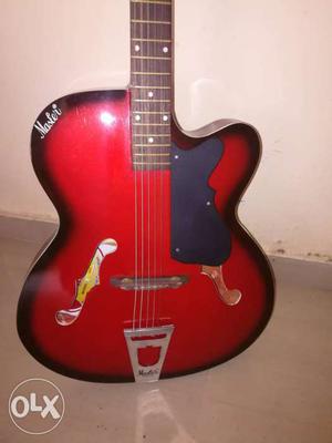 Brown And Red Cutaway Acoustic Guitar