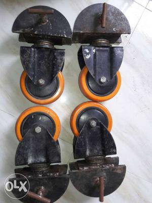 Four Black-and-yellow Caster Wheels