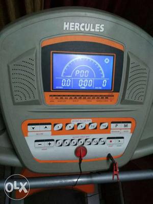 Gray And Orange Hercules Automatic Treadmill in good