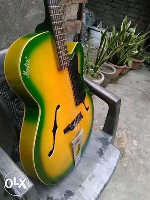 Green And Yellow Cutaway Guitar