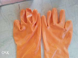 Pair Of Orange Leather Gloves