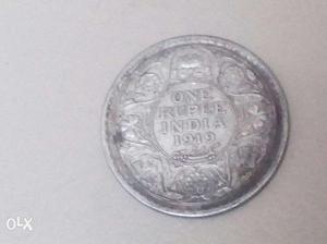 Round Silver-colored 1 Rupee  Coin