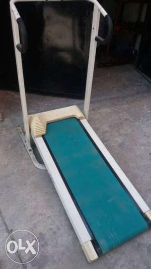 Teal, White, And Beige Manual Treadmill