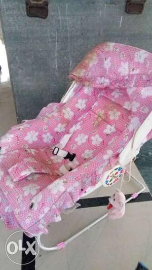 Baby's Pink And White Bouncer Seat