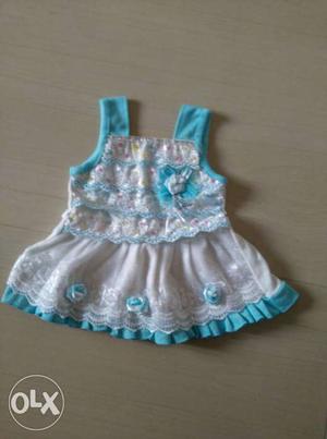 Girl's White And Teal Floral Frocks