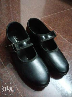 Pair Of Black Leather Mary Jane Shoes