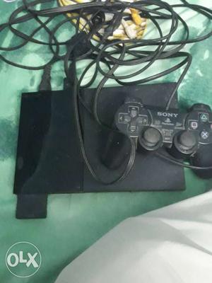 Sony Ps2 along with a memory card and 1 original
