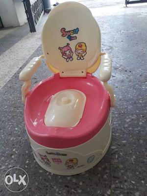 Toddler's Beige And Pink Potty Trainer
