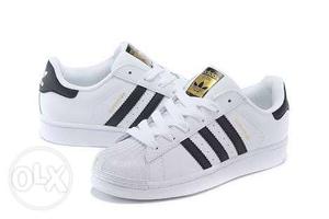 Brand new Adidas Superstar shoes of size 8.