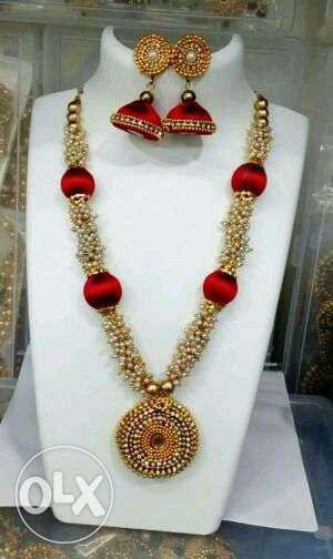 Gold Necklace And Pair Of Jhumka Earrings