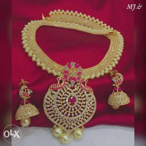 Gold-colored Bib Necklace And Pair Of Jhumka Earrings