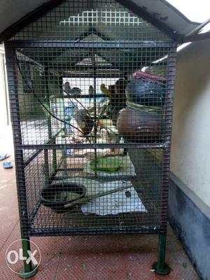 Green And Brown Metal Pet Cage