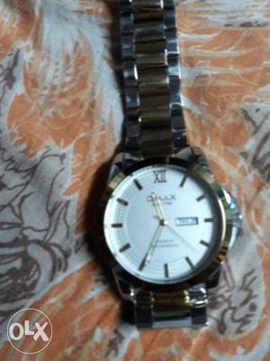 Omax watch original with box,in gold