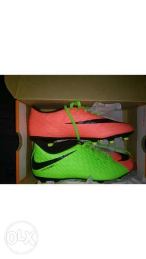 Pair Of Pink And Green Nike Cleats