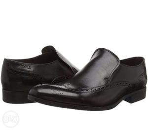 Pair Of clarks Black Wingtip Leather Dress Shoes