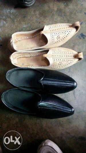 Two Pairs Of White And Black Kussa Traditional Shoes