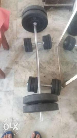 Black And Gray Barbell And Two Dumbbells