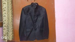 Black shimmery suit in good condition worn once Length 28