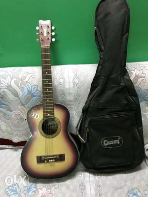 Brown And Black Acoustic Guitar With Gig Bag