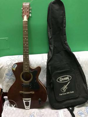 Brown Cutaway Acoustic Guitar With Guitar Case