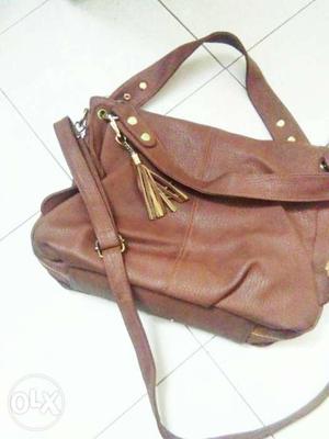 Brown hand bag with two types and only two times weard