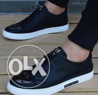 Pair Of Black Leather Mid-top Sneakers