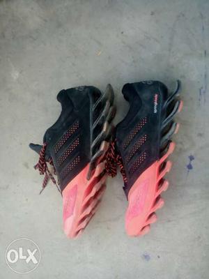 Pair Of Black-and-pink Adidas Running Shoes