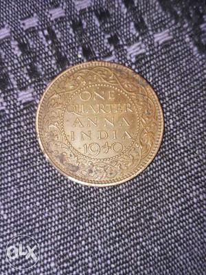 Round Gold-colored One Quarter Anna India Coin
