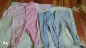 Toddler's Pink Footie Pajama And Two Blue Pajamas