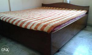 75 inches x 82 inches box bed with mattress.