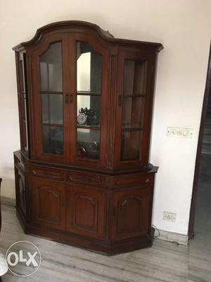 A beautiful teak wood cabinet to store crockery