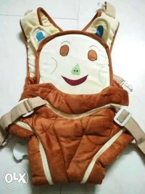 Baby's White And Brown Carrier