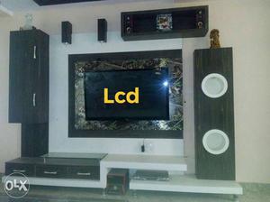 Black Flat Screen TV; White Wooden Entertainment Center