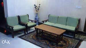 Brown Wooden Frame And Green Cushion Armchairs with center