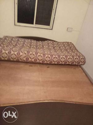 Brown Wooden Panel Bed With Brown Mattress