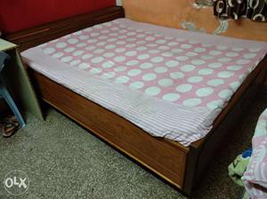 Brown wooden Bed