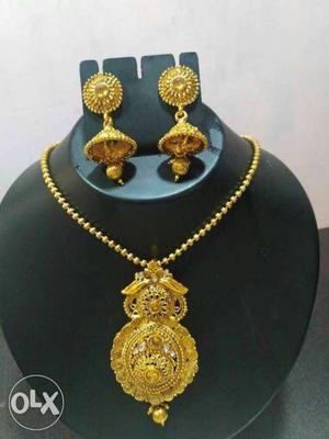 Gold Bib Necklace And Jhumkas