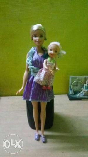 Orginal Barbie doll with normal kid doll