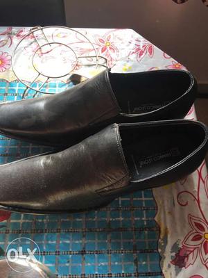 Pair Of Black Leather Dress Shoes