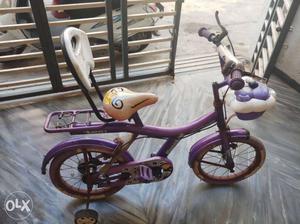 Purple And White Bicycle With Training Wheels