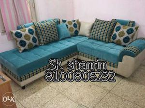Quilted Teal Sectional Sofa With White Leather Abse