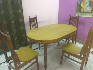Round Brown Wooden Table With Four Chairs
