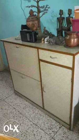 Shoe cabinet with gas cylinder case and drawer