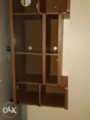 TV cabinet with lot of slots and Racks.